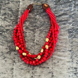 Red with gold necklace